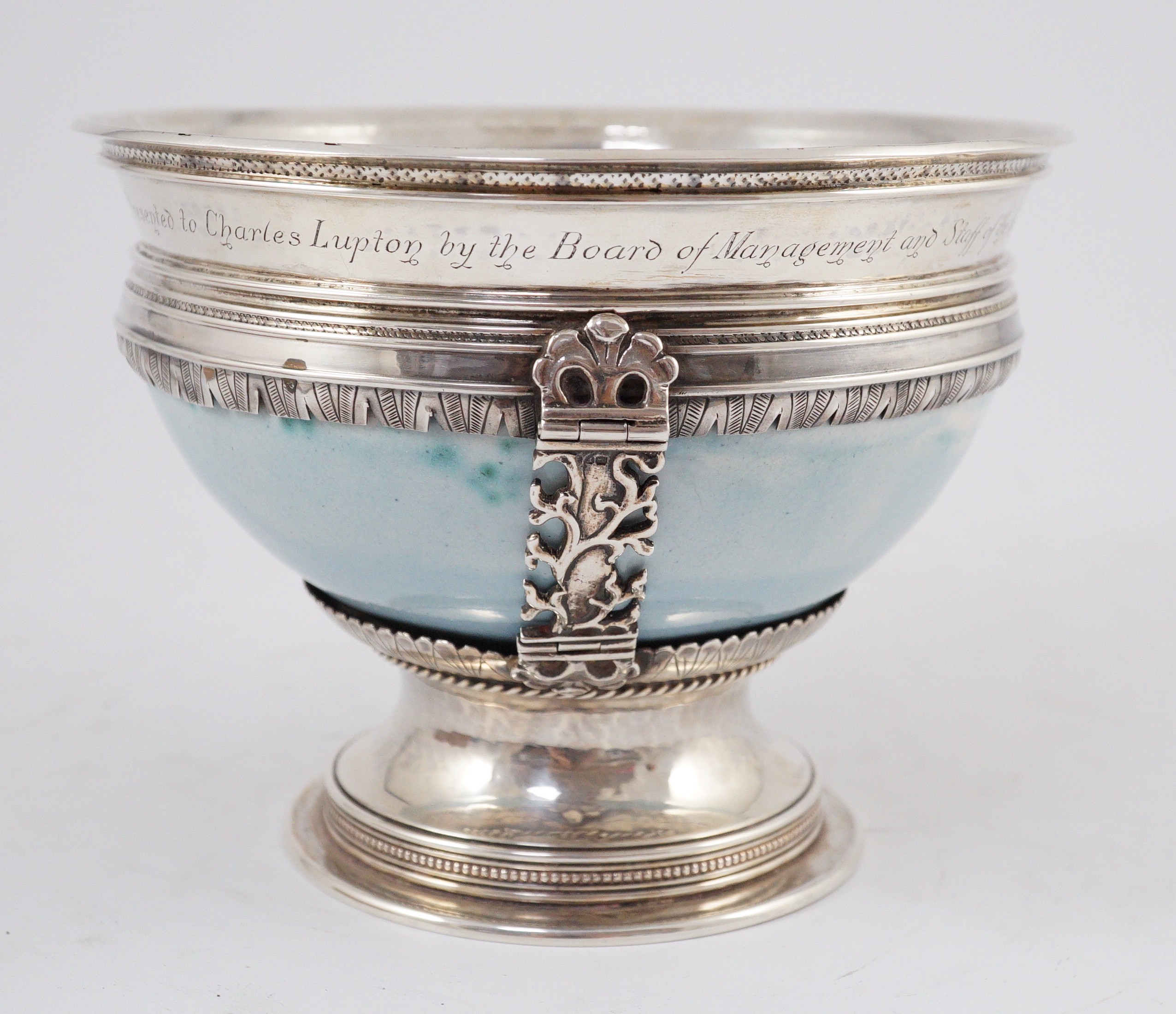 An Arts and Crafts silver mounted Ruskin pottery pedestal bowl, the silver mounts by A.E. Jones, Birmingham 1929, 16.5cm diameter